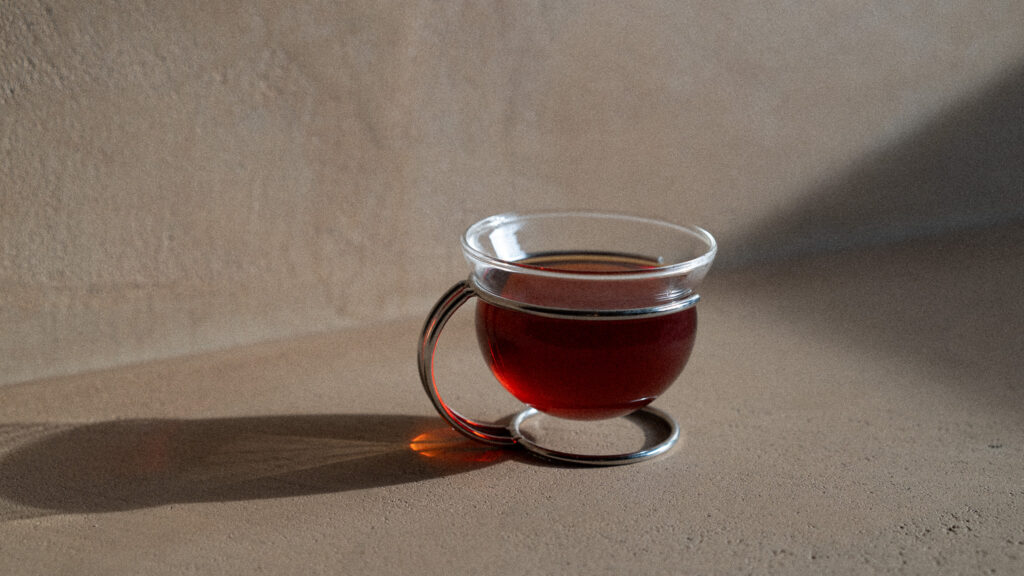 A drink poured into a glass cup